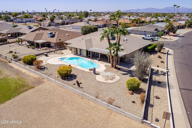 view of pool featuring a mountain view and a patio area