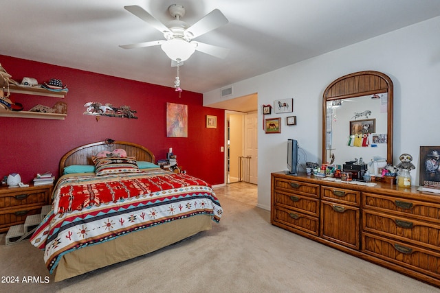 bedroom featuring ceiling fan and light carpet