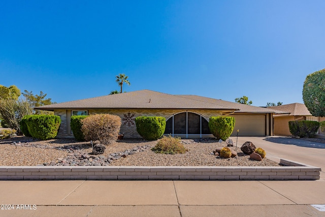 ranch-style house featuring a garage