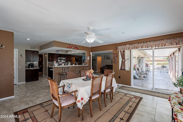 dining room featuring ceiling fan