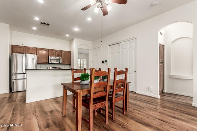 dining area with visible vents, ceiling fan, baseboards, recessed lighting, and wood finished floors