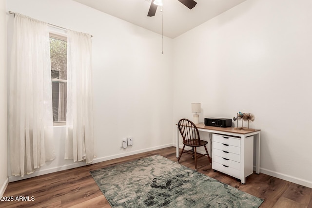 home office featuring ceiling fan, baseboards, and wood finished floors