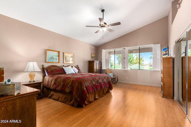 bedroom with ceiling fan, high vaulted ceiling, and light wood-type flooring