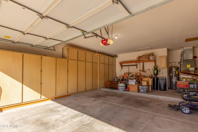 garage with a garage door opener and water heater