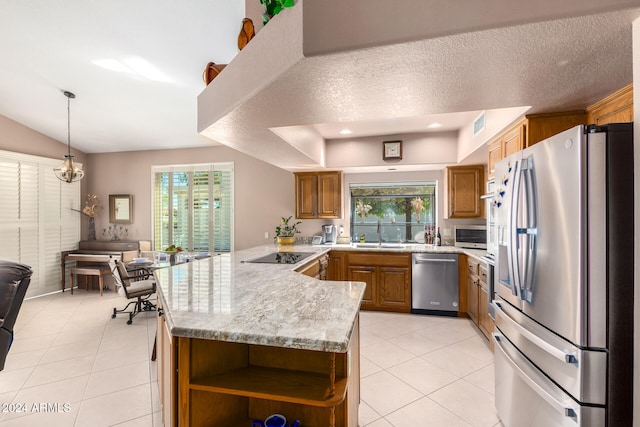 kitchen featuring kitchen peninsula, light tile patterned floors, appliances with stainless steel finishes, a textured ceiling, and sink