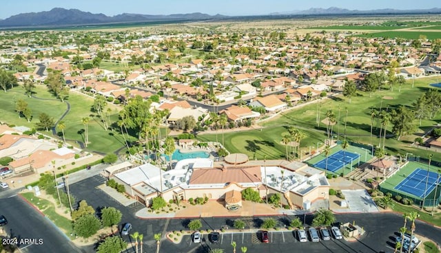 birds eye view of property with a mountain view