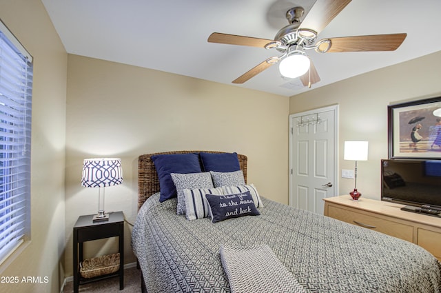 bedroom featuring ceiling fan and a closet