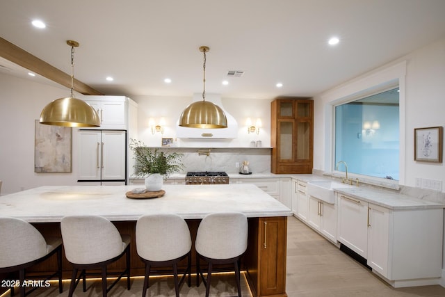 kitchen with visible vents, dishwashing machine, stove, paneled fridge, and a sink