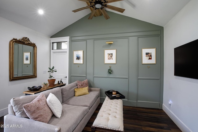 living room with lofted ceiling, a ceiling fan, dark wood-style flooring, and baseboards