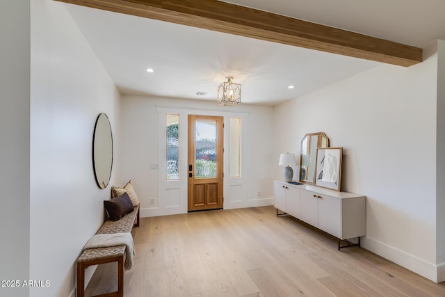 entrance foyer with a notable chandelier, recessed lighting, baseboards, and light wood-style floors