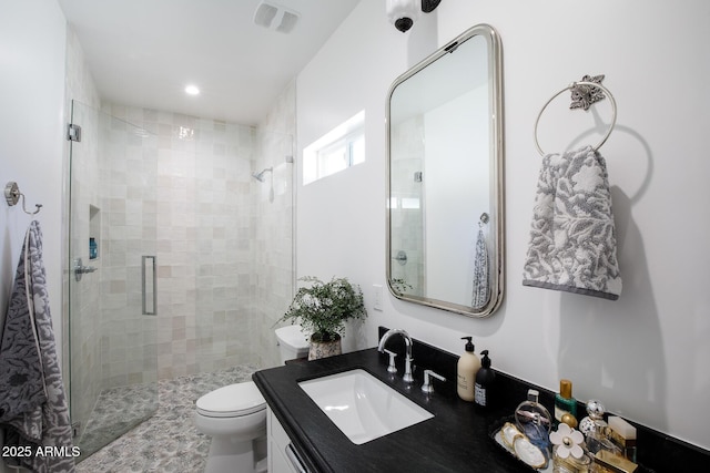 full bath featuring vanity, visible vents, recessed lighting, a stall shower, and toilet