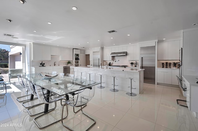 tiled dining area featuring sink