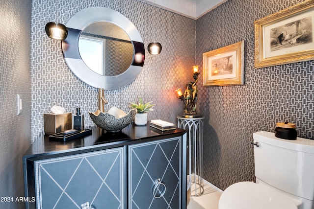 bathroom with decorative backsplash, toilet, and tile walls