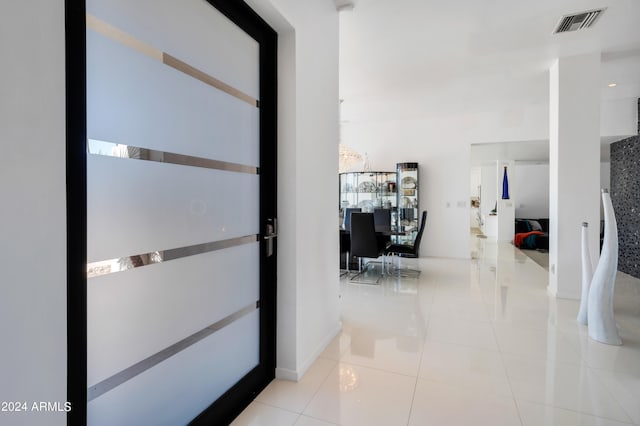 corridor with light tile patterned floors