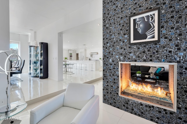 tiled living room with a tile fireplace