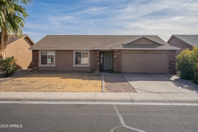 ranch-style home featuring a garage