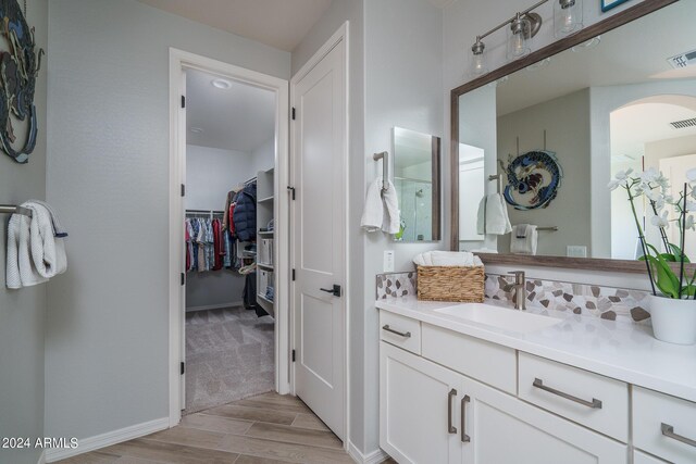 bathroom featuring vanity and hardwood / wood-style floors