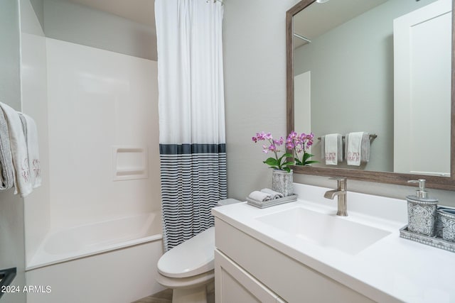 full bathroom with vanity, shower / bathtub combination with curtain, and toilet