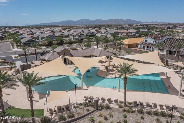 view of swimming pool with a mountain view