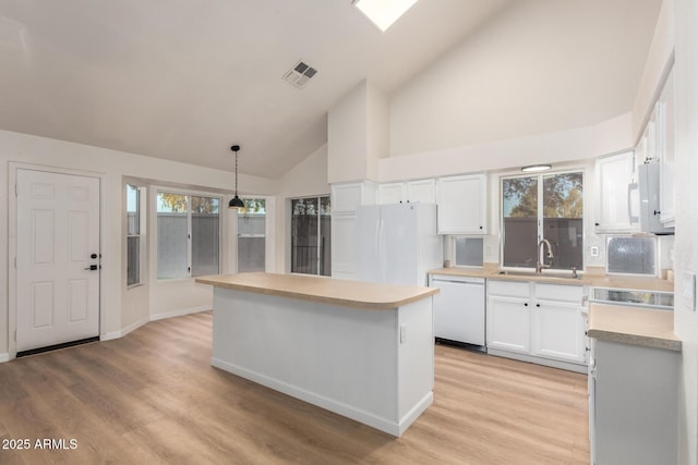1405 N Jamaica Way, Gilbert, AZ 85234 - kitchen featuring white appliances, high vaulted ceiling, a kitchen island, white cabinets, and light countertops