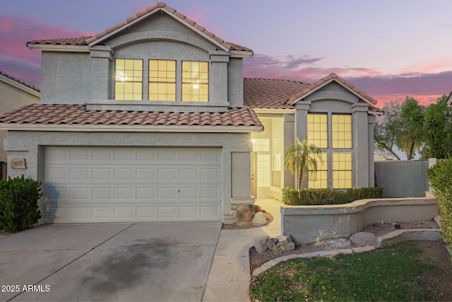1405 N Jamaica Way, Gilbert, AZ 85234 - view of front facade with concrete driveway, a tile roof, an attached garage, and stucco siding