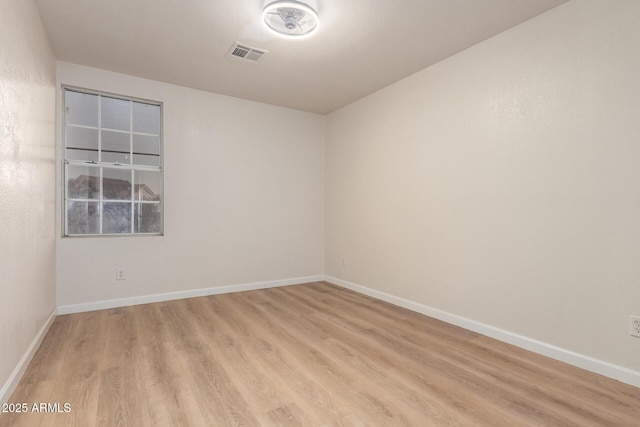 1405 N Jamaica Way, Gilbert, AZ 85234 - spare room with light wood-style flooring and baseboards
