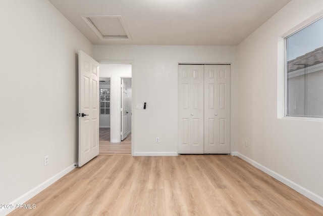 1405 N Jamaica Way, Gilbert, AZ 85234 - unfurnished bedroom featuring light wood finished floors, attic access, and a closet