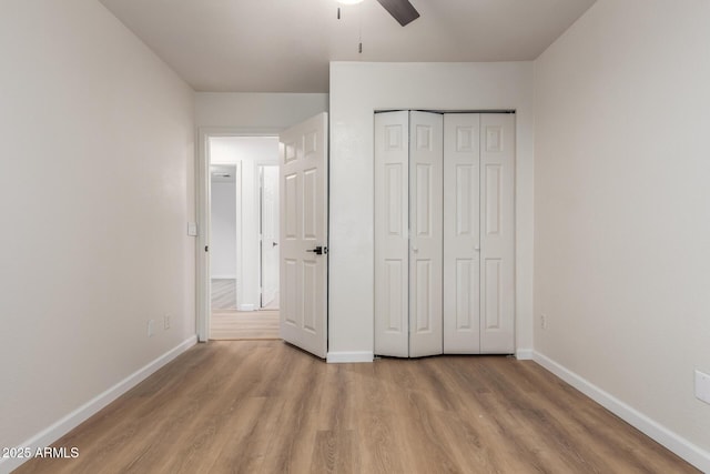 1405 N Jamaica Way, Gilbert, AZ 85234 - unfurnished bedroom featuring wood finished floors, a closet, and a ceiling fan