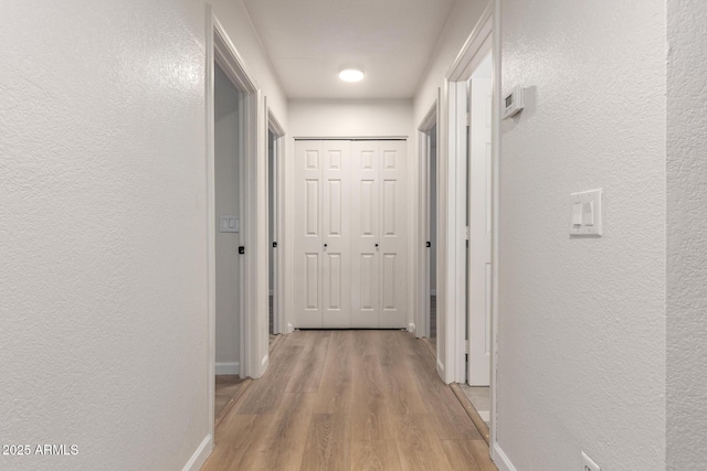 1405 N Jamaica Way, Gilbert, AZ 85234 - corridor featuring a textured wall and light wood-style flooring