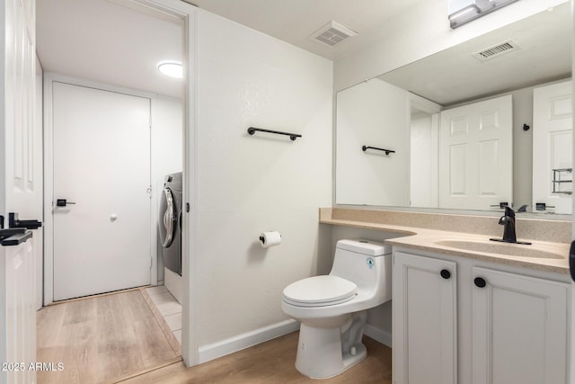 1405 N Jamaica Way, Gilbert, AZ 85234 - bathroom with wood finished floors, vanity, and washer / dryer