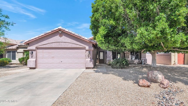 15740 N 91st Dr, Peoria, AZ 85382 - single story home with a garage, driveway, a tiled roof, and stucco siding