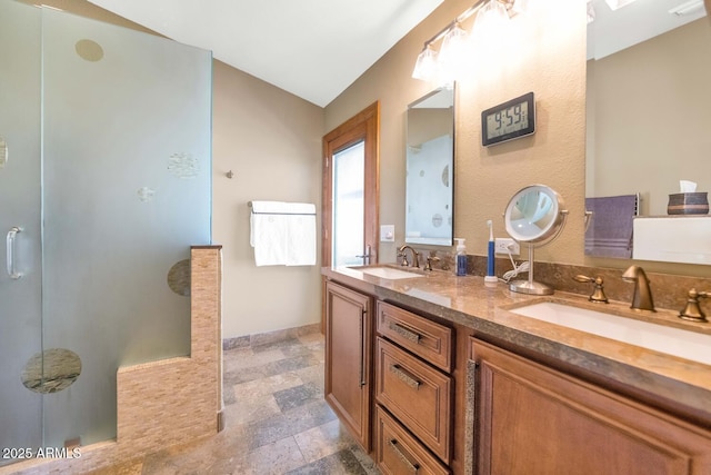15740 N 91st Dr, Peoria, AZ 85382 - bathroom with double vanity and a walk in shower
