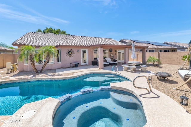 15740 N 91st Dr, Peoria, AZ 85382 - view of swimming pool with an outdoor fire pit, a pool with connected hot tub, and a patio area