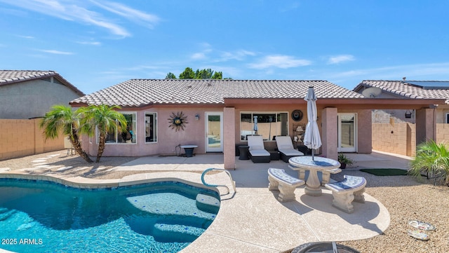 15740 N 91st Dr, Peoria, AZ 85382 - back of property with a tile roof, a patio, and stucco siding