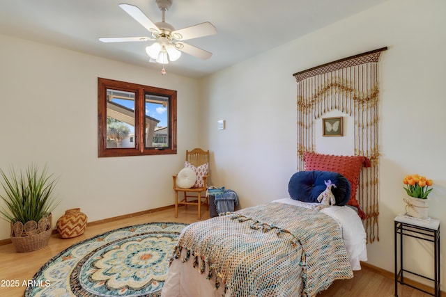7526 E Edgemont Ave, Scottsdale, AZ 85251 - bedroom featuring wood finished floors, baseboards, and a ceiling fan
