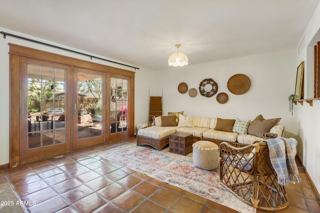 7526 E Edgemont Ave, Scottsdale, AZ 85251 - living room with french doors, baseboards, and a chandelier
