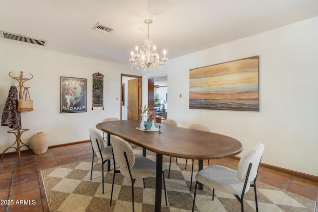 7526 E Edgemont Ave, Scottsdale, AZ 85251 - dining space featuring baseboards, a chandelier, and tile patterned flooring