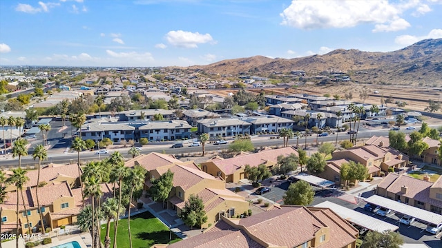 birds eye view of property featuring a mountain view