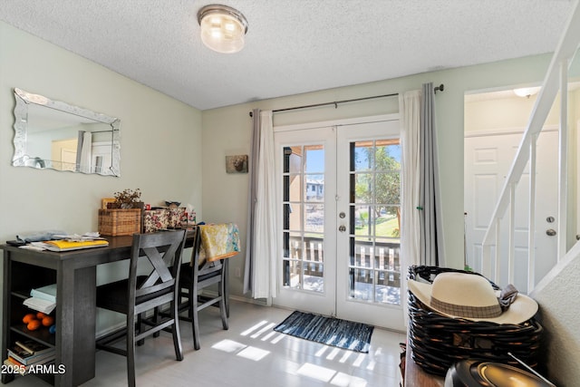 doorway featuring french doors and a textured ceiling