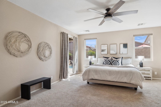 bedroom featuring multiple windows, baseboards, visible vents, and carpet floors