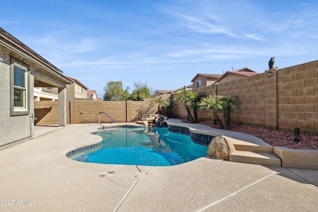 view of swimming pool featuring a patio area, a fenced backyard, and a fenced in pool