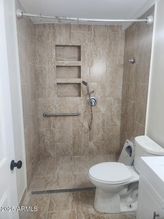bathroom with toilet and a shower stall