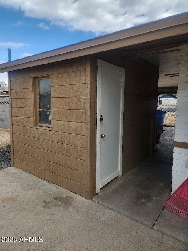 property entrance featuring fence