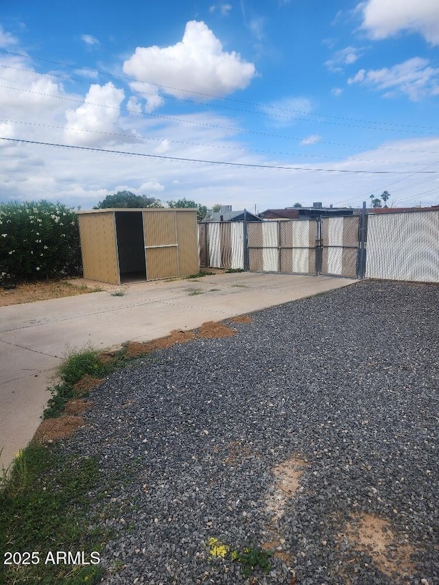view of yard with an outbuilding and fence