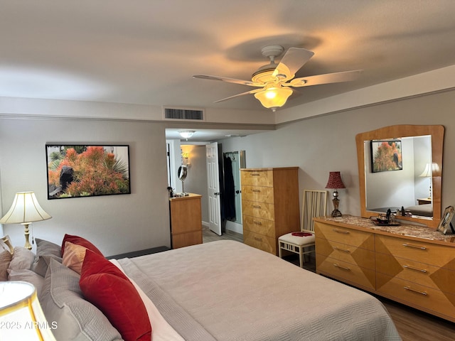 bedroom featuring ceiling fan and hardwood / wood-style floors