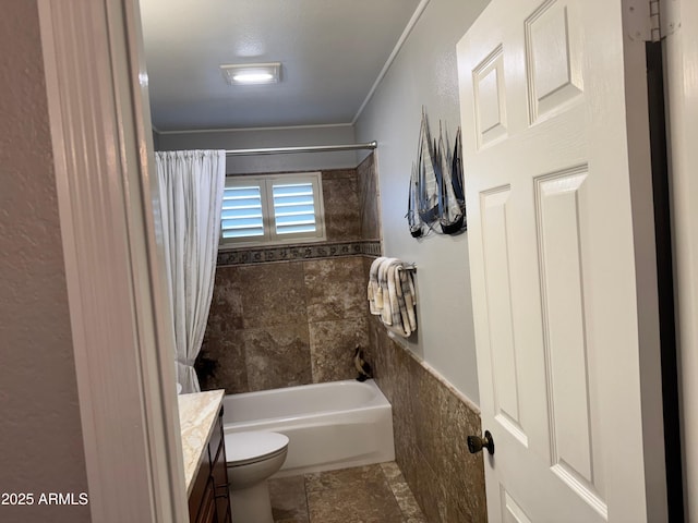 full bathroom featuring vanity, shower / tub combo, and toilet