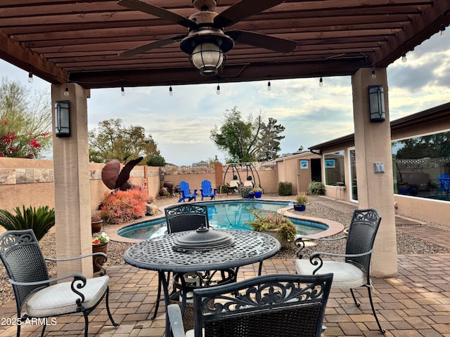 view of patio / terrace with a fenced in pool and a pergola