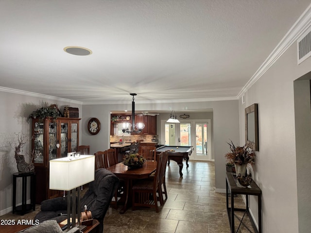 dining room with crown molding