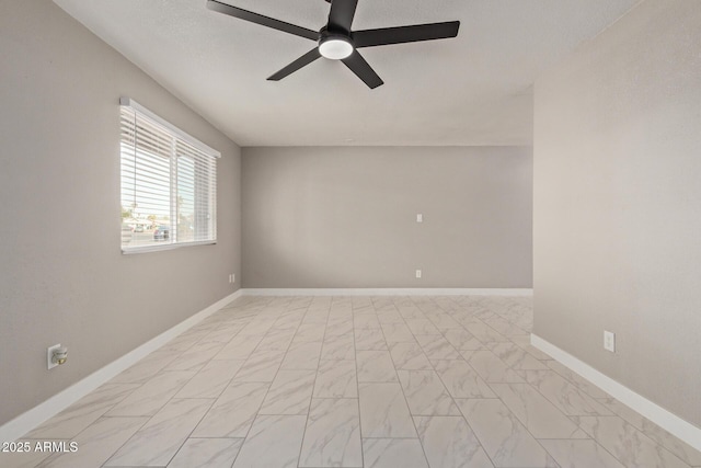 spare room with ceiling fan