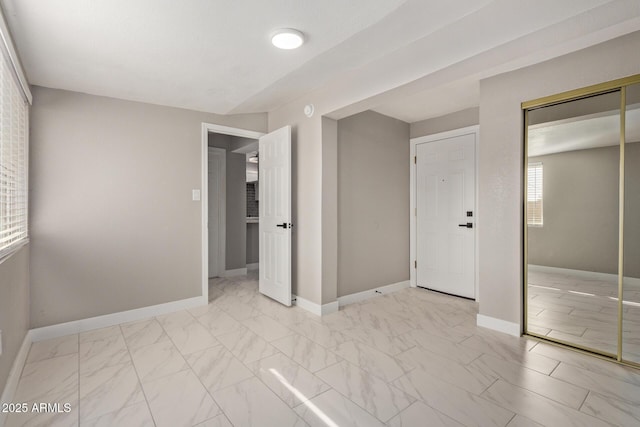 unfurnished bedroom featuring a closet